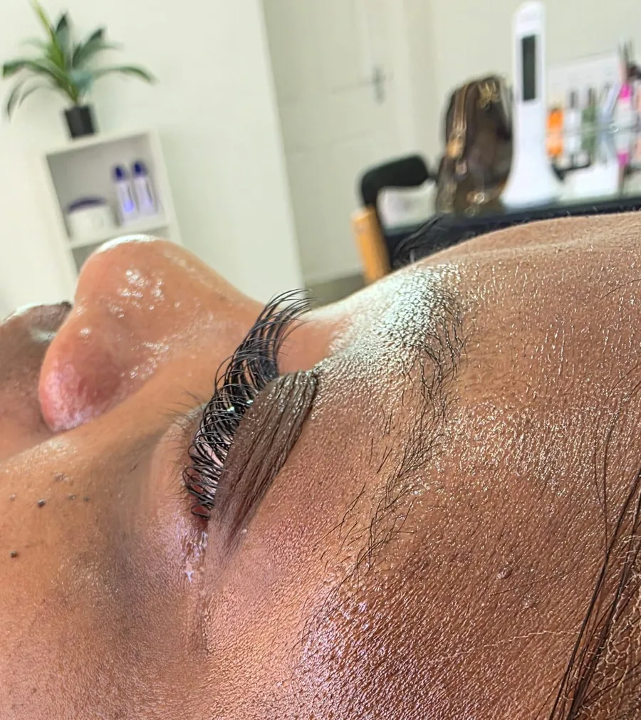 Lash extensions being applied