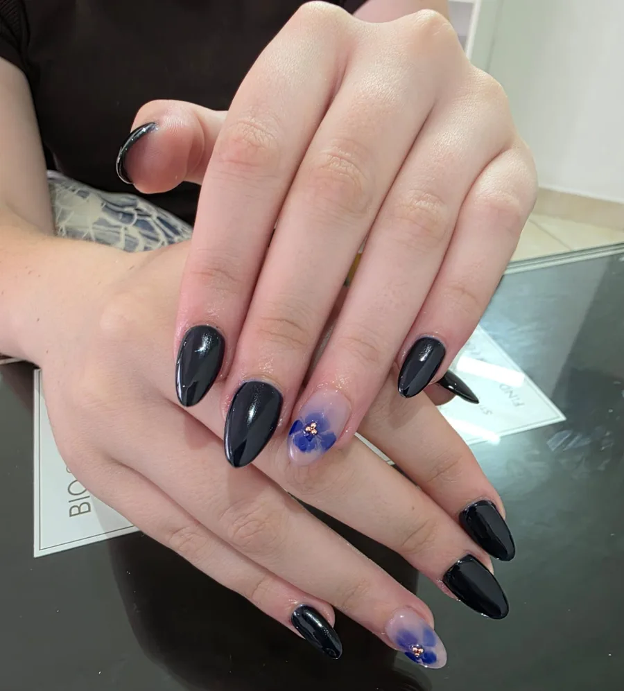 Black almond nails with floral accent