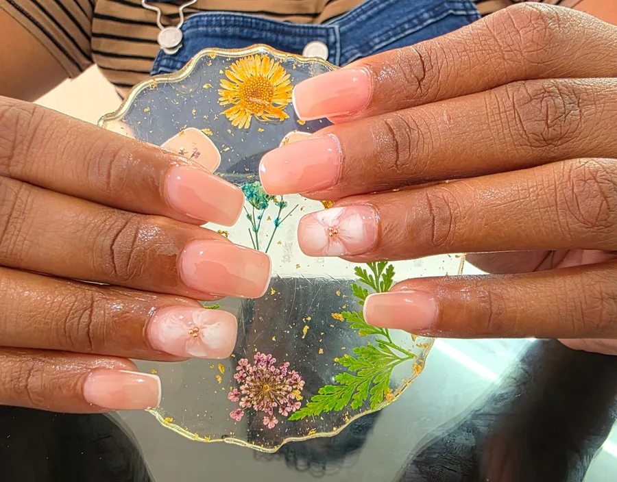 Peach pink nails with flower details