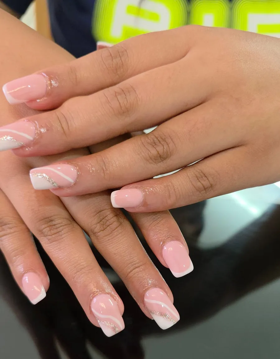 Pink gel nails with swirl design