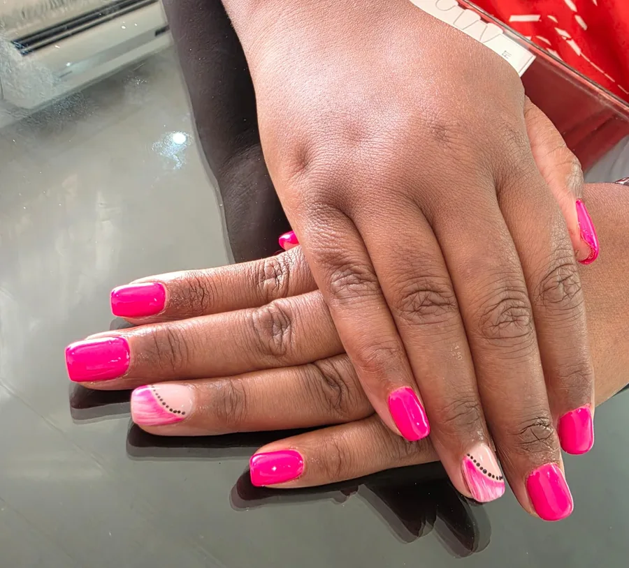 Hot pink nails with swirl accent